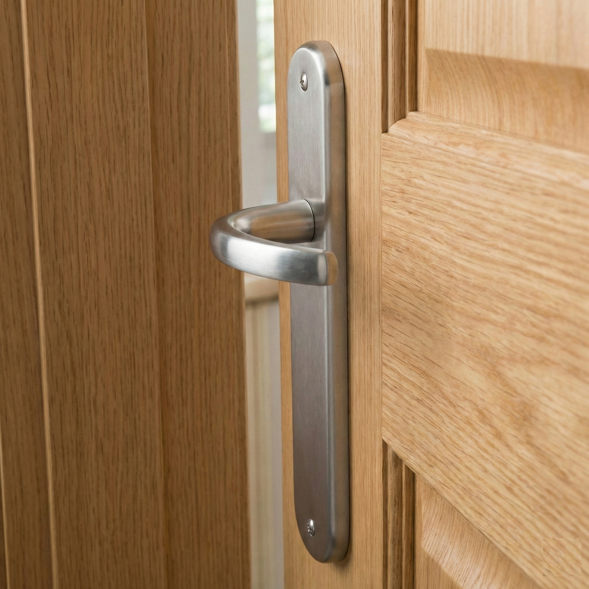 '110' model zamak door handle with oval plate in satin nickel finish