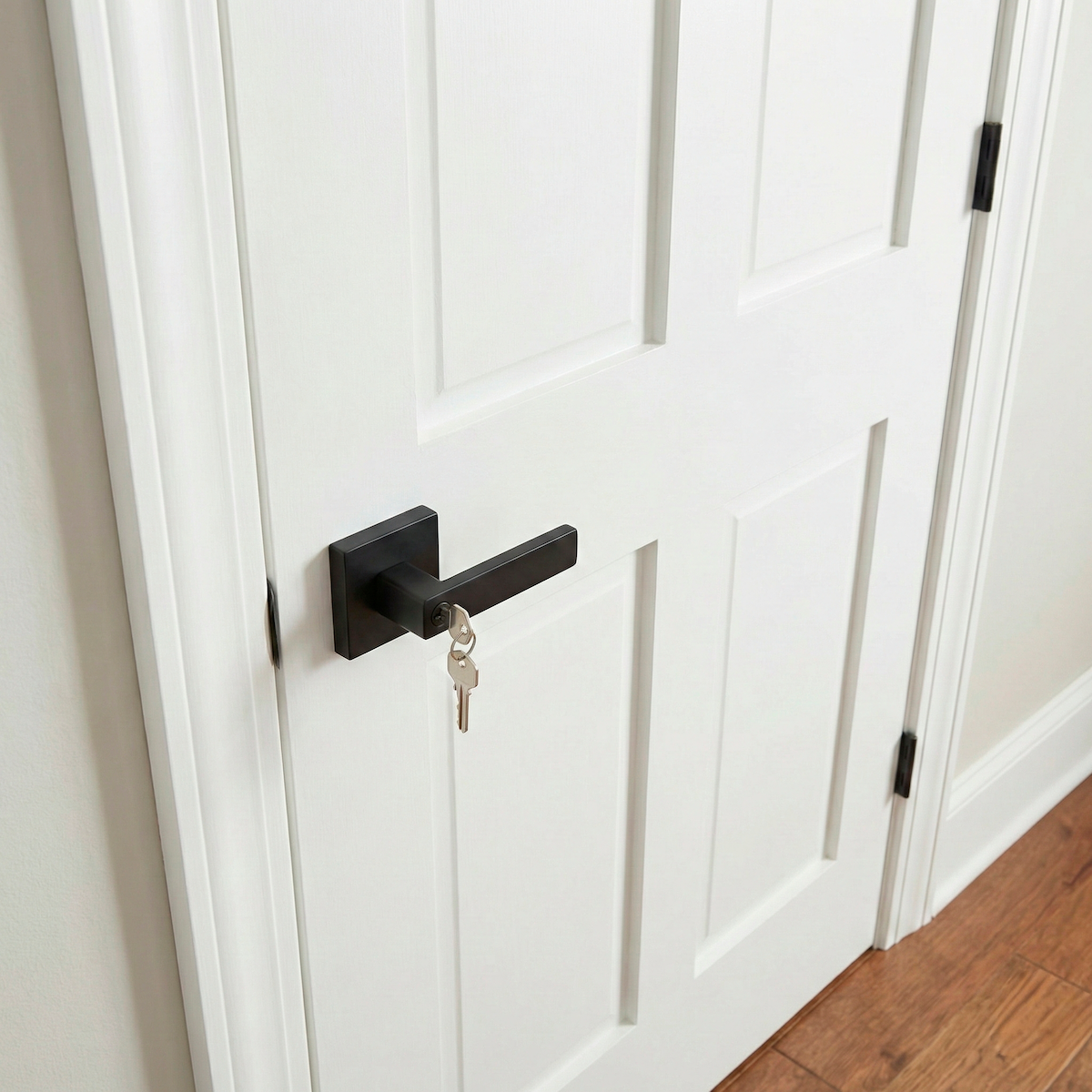 Black Leon door handle with lock and square rosette for entry doors